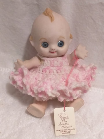 Small ceramic Kewpie doll porcelain knitted pink dress